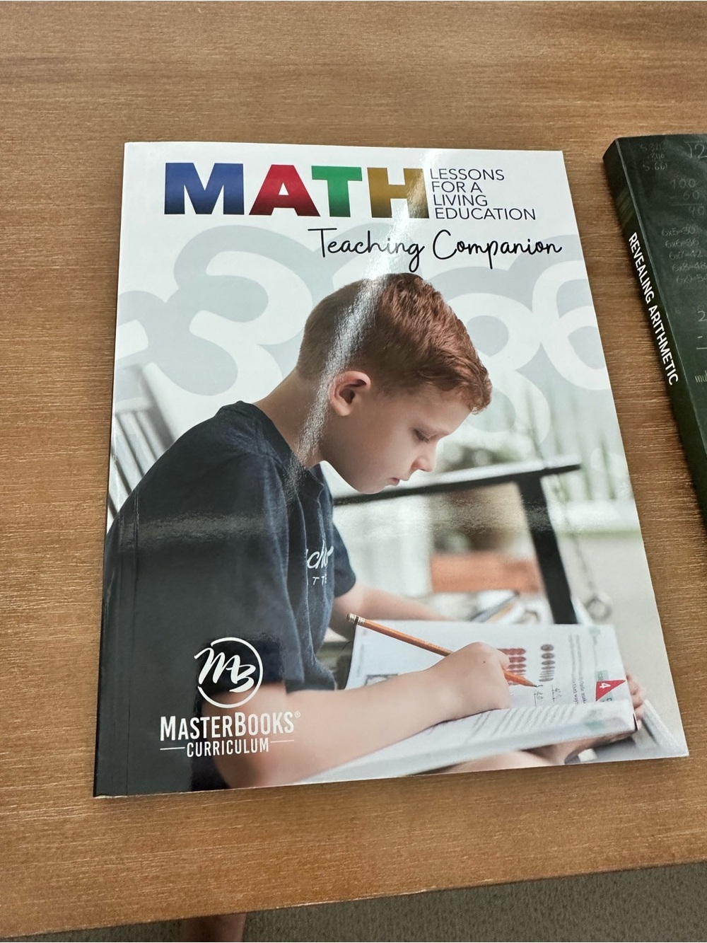MasterBooks Math Teaching Companion & Revealing Arithmetic book bundle
